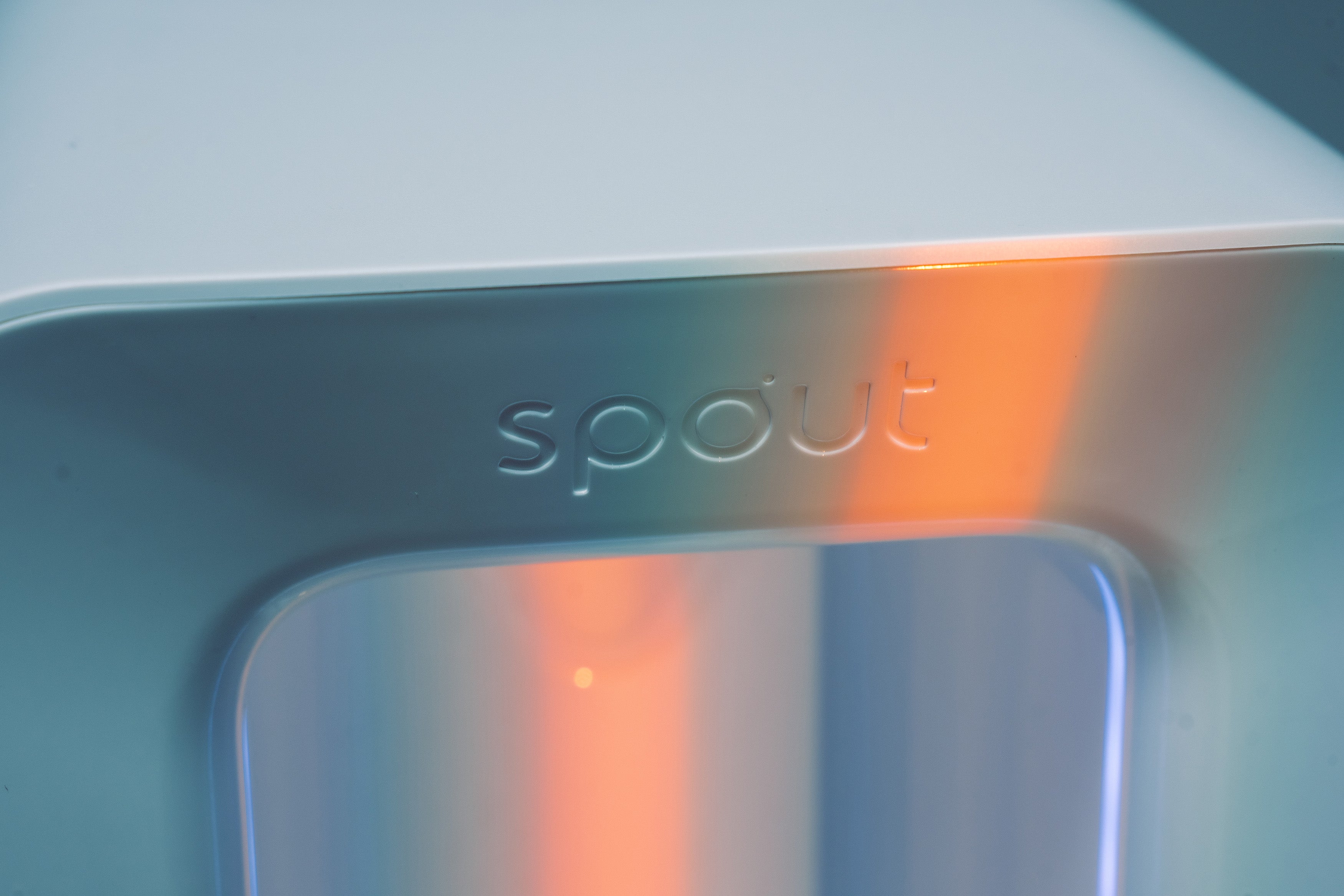 Spout logo closeup with warm light