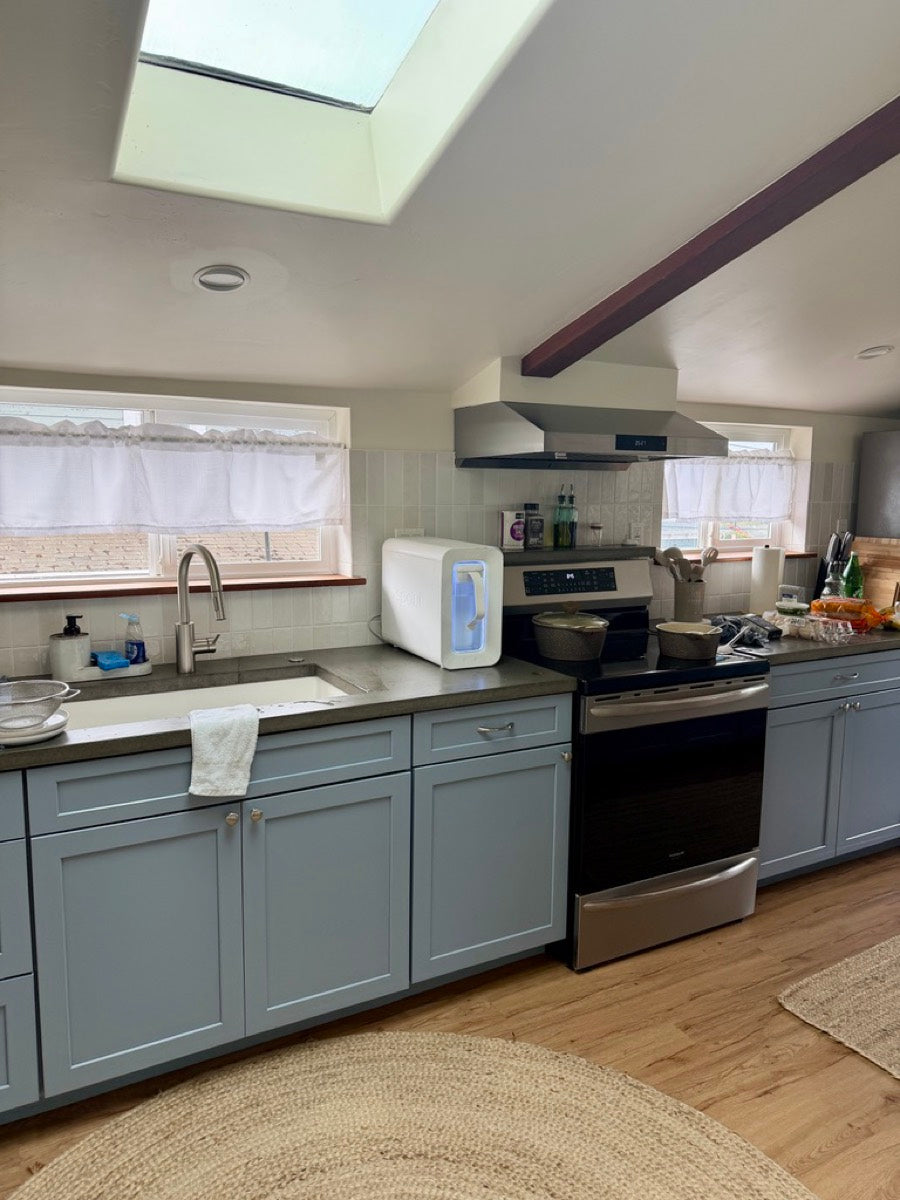 Spout Monolith on a blue-cabinet kitchen counter